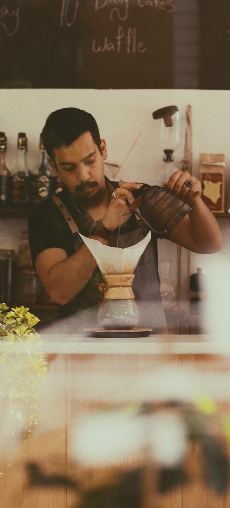 Barista brewing coffee at Ein Coffee House